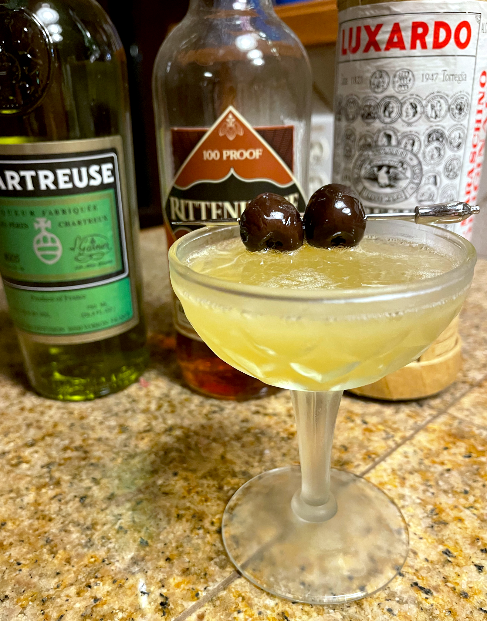 Final Ward cocktail: a yellow colored cocktail in a coupe
