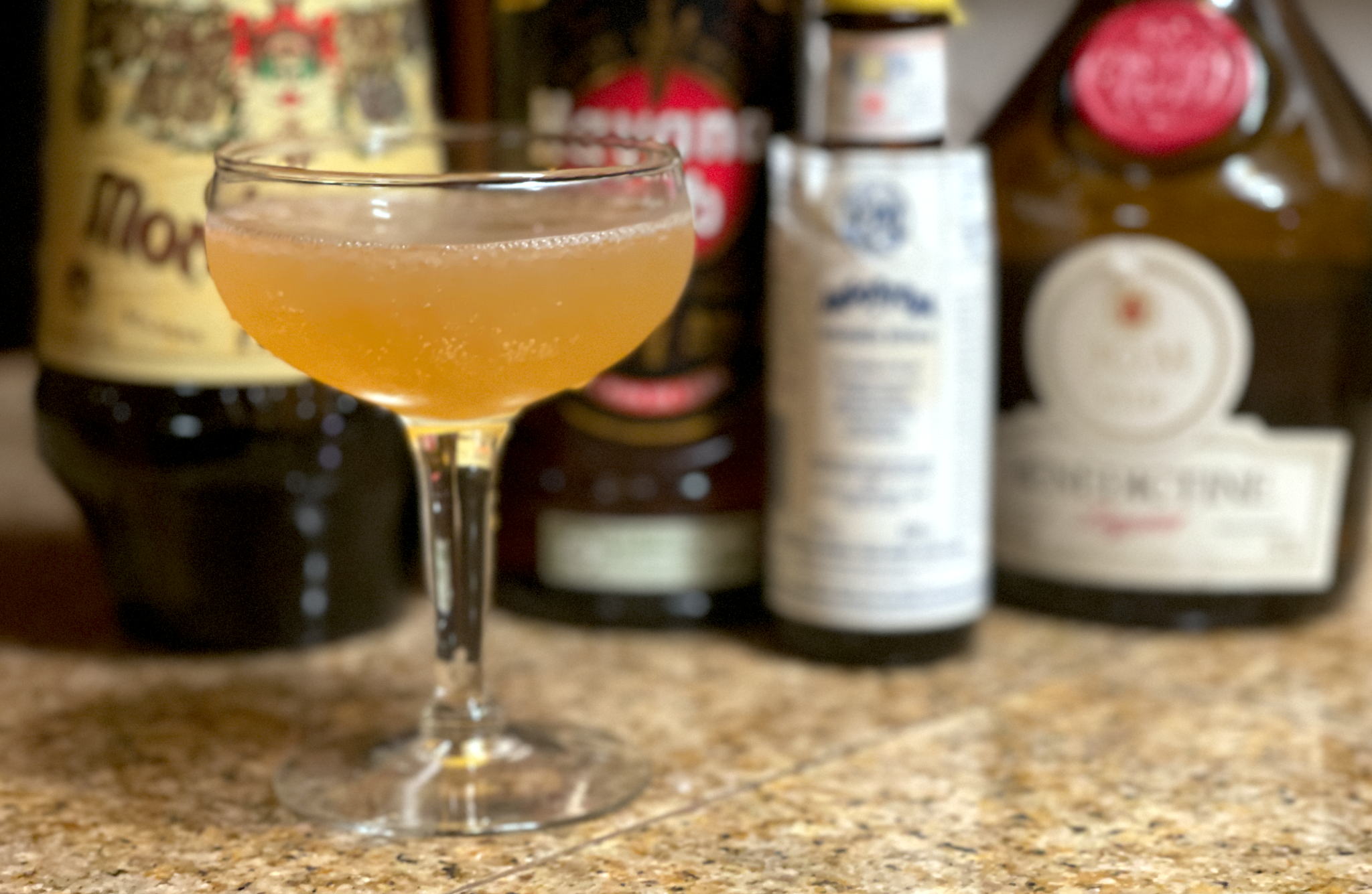 Spanish Lady cocktail: a yellow colored cocktail in a glass